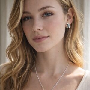 Glacier Pearle frog earrings with abalone shell inlay.